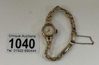 A 9ct Gold ladies Avia watch. Total weight 13.10g