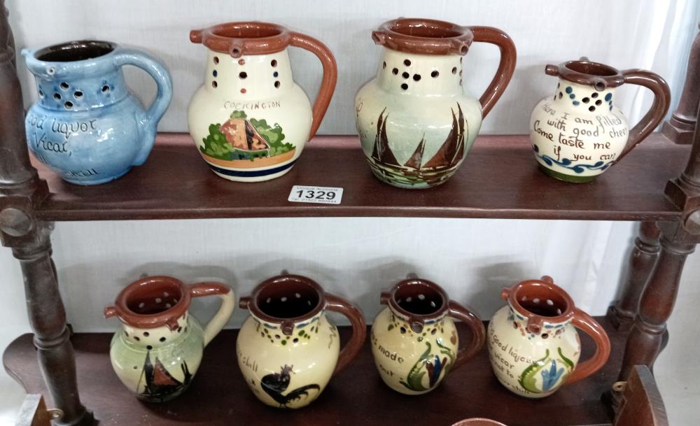 8 Torquay ware mid size puzzle jugs