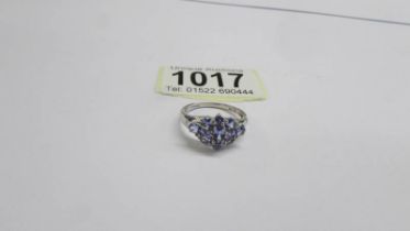 A white gold tanzanite and diamond cluster ring, size P half, 2.8 grams.