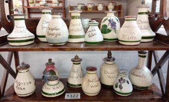 2 shelves of Devon pottery oil/perfume bottles