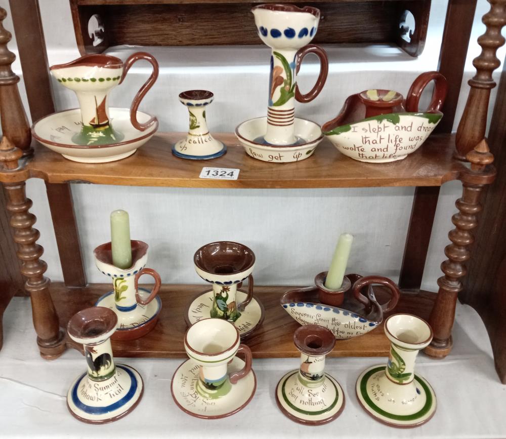 11 Torquay ware candlesticks