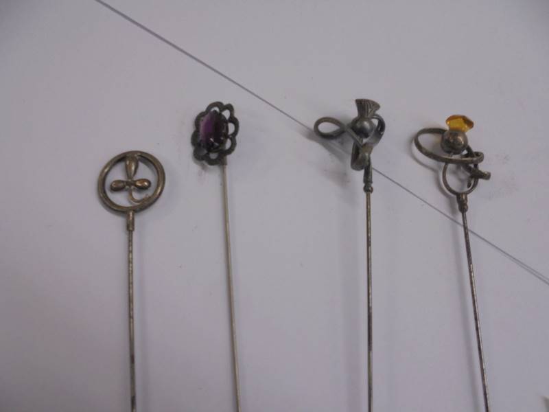 Four unmarked early 20th century hat pins. - Image 2 of 6