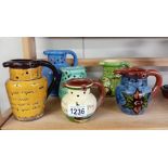 6 Puzzle jugs including Torquay ware