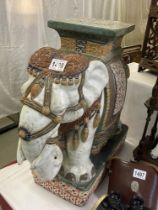 A late 19th/early 20th century ceramic elephant garden seat/pot stand