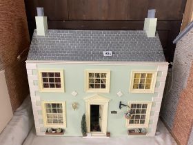 A Georgian style 2 storey dolls house and contents