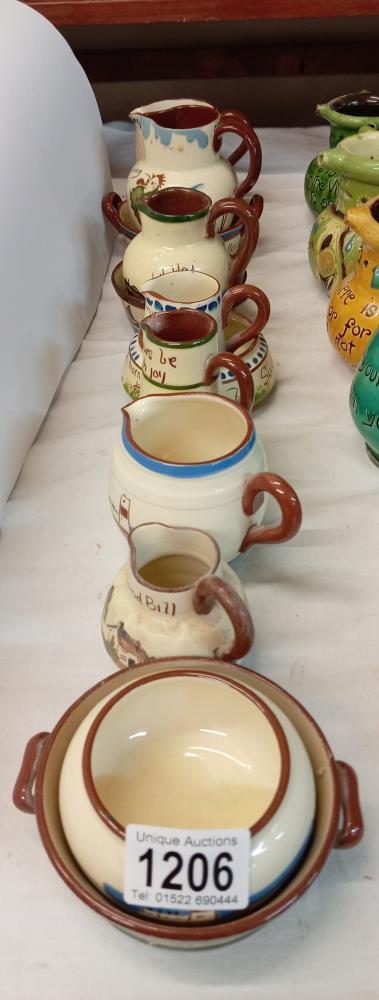 A selection of Torquay pottery small jugs & dishes