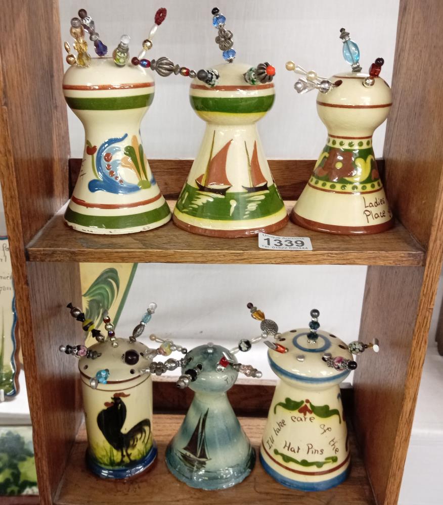 6 Torquay ware hat pin stands