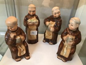 A set of 4 German monk decanters