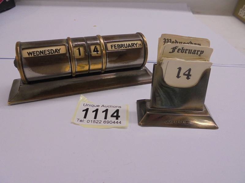 A silver perpetual desk calendar and a brass example.