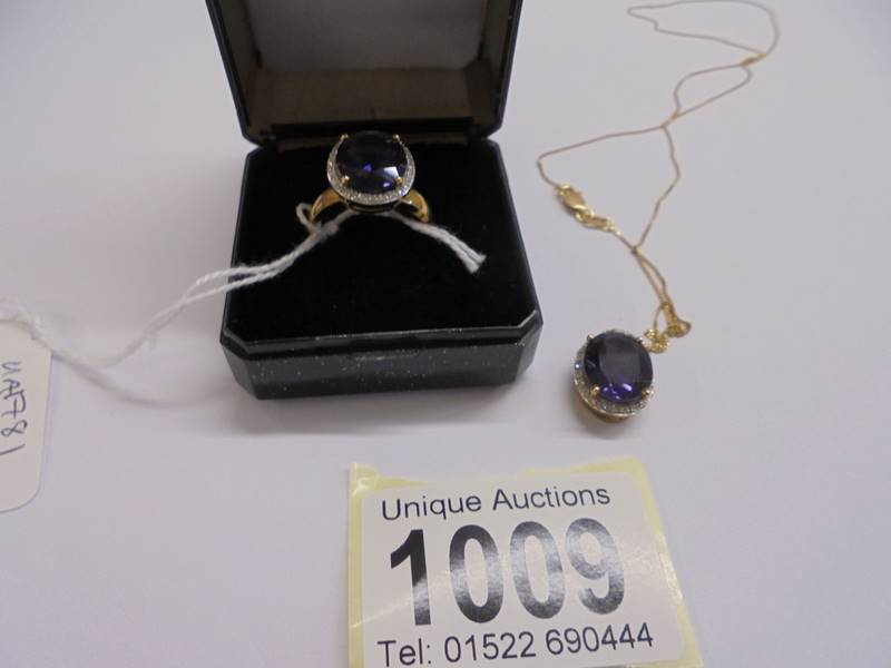 A 9ct gold ring set amethyst coloured stone, size O half with matching pendant, 7.25 grams total.