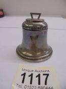 An unusual bell shaped silver inkwell.