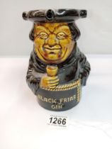 A Dartmouth pottery Black Friar gin Toby puzzle jug. Height 17cm