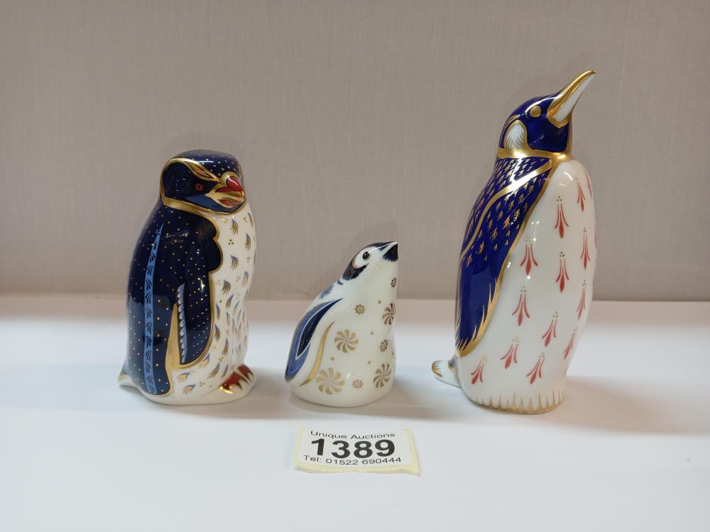 3 Royal Crown Derby Penguin paperweights, 2 with gold stoppers, 1 with silver stopper