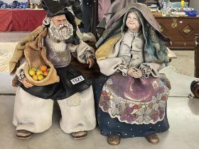 A Sardinian old man and old woman sitting figurine