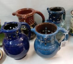 4 puzzle jugs including C M Brannam Barum pottery