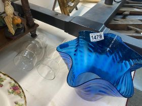 A blue glass oil lamp shade and 2 chimneys
