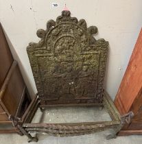 A Georgian cast iron fire dog grate