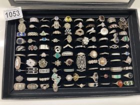 A Good tray of 100 sterling silver metal rings .