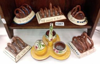 5 Torquay ware toast racks & a cruet stand