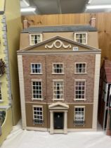 A Georgian style dolls house with contents