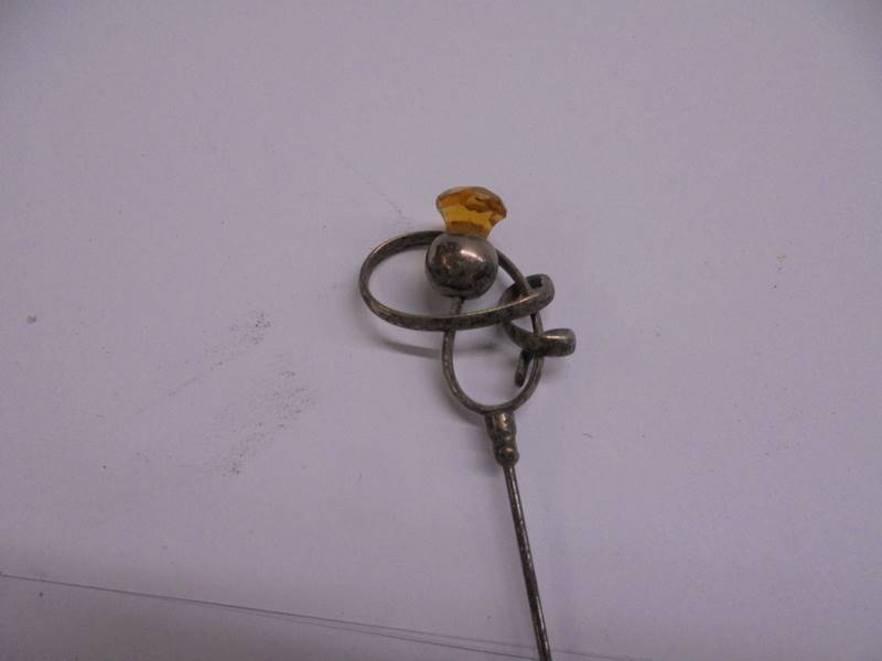 Four unmarked early 20th century hat pins. - Image 3 of 6