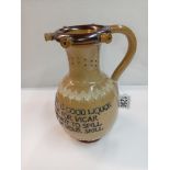 A Doulton Lambeth stoneware puzzle jug. Height 23cm