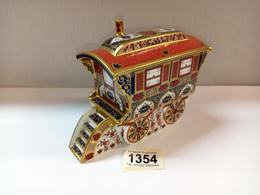 A Royal Crown Derby caravan with gold stopper
