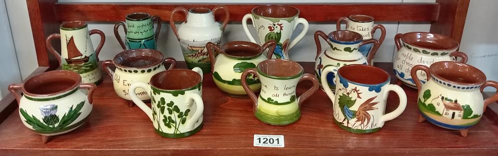 A good selection of Torquay pottery including Cauldrons, Loving cups & 2 handle vases