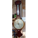 A Victorian barometer with silvered dial