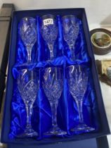 A boxed set of Rockingham crystal wine glasses