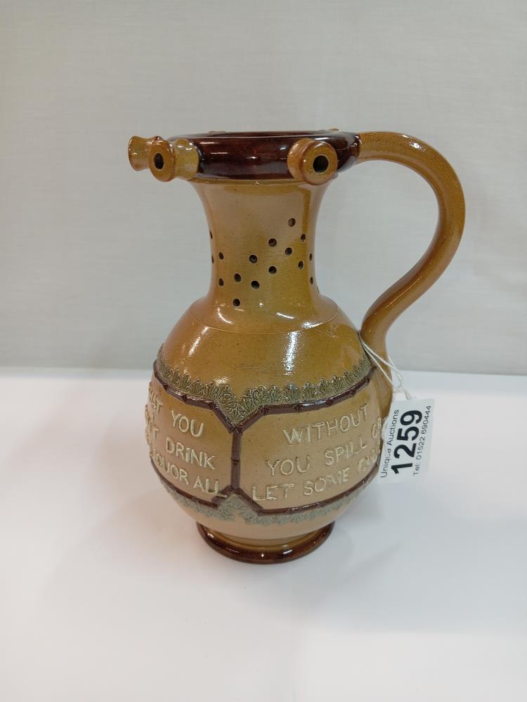 A Doulton Burslem puzzle jug. Height 17.5cm