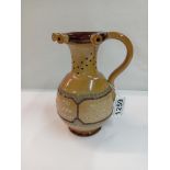 A Doulton Burslem puzzle jug. Height 17.5cm