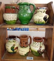 6 mid size Torquay ware puzzle jugs