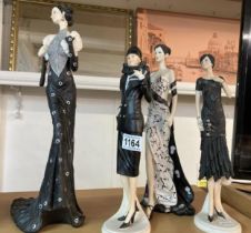 Four fashion lady figurines