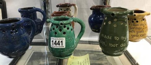 A collction of 8 Motto ware and puzzle jugs