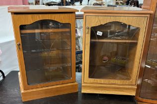 A pair of teak effect music cabinets