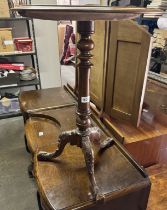 A circular walnut and marquetry inlaid side table with carved tripod legs. (52 x 72cm)