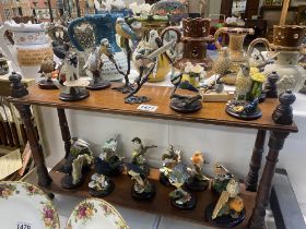 A collection of bird figures including Country artists, Benbrook etc