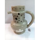 A 19th century stoneware jasperware puzzle jug, Height 20cm (handle repaired)