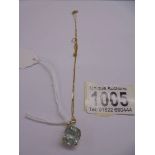 A 9ct gold pendant set green stone on gold chain (chain knotted). 3.27 grams.