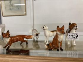 Three Beswick hounds & Two Beswick foxes