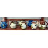 9 Torquay pottery puzzle jugs