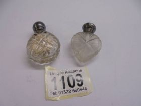 Two silver topped 19th century glass scent/smelling salt bottles.