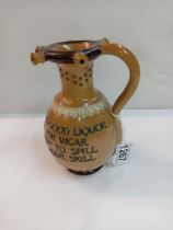 A Doulton Lambeth stoneware puzzle jug. Height 17cm. A/F
