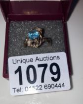 A vintage blue zircon ring set with two pearls in a rope twist setting stamped 10ct gold size L 1/4