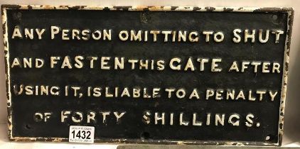 A cast metal railway sign