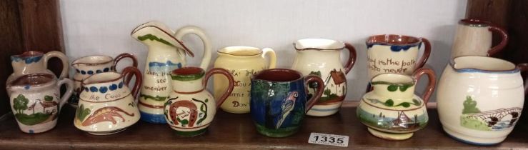 13 Torquay ware small jugs
