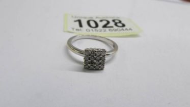 An art deco 18ct gold square pattern diamond ring, size N, 2.37 grams.