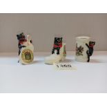 3 pieces of crested ware with attached black cats