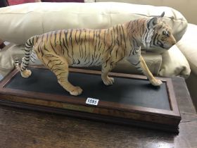 A Large Tiger on wooden base 'On the prowl' by Franklin Mint. Length 56cm Height 25cm at tallest